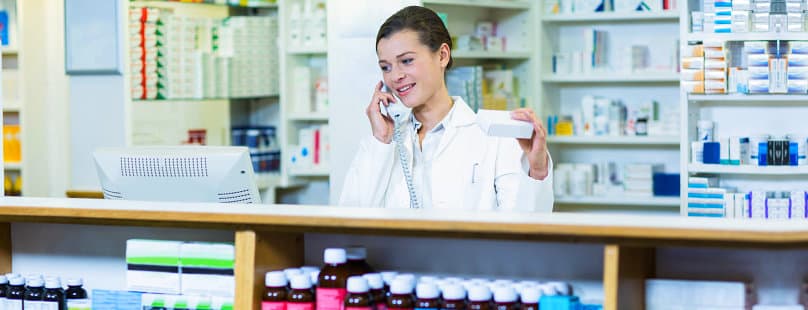female pharmacist taking on the phone